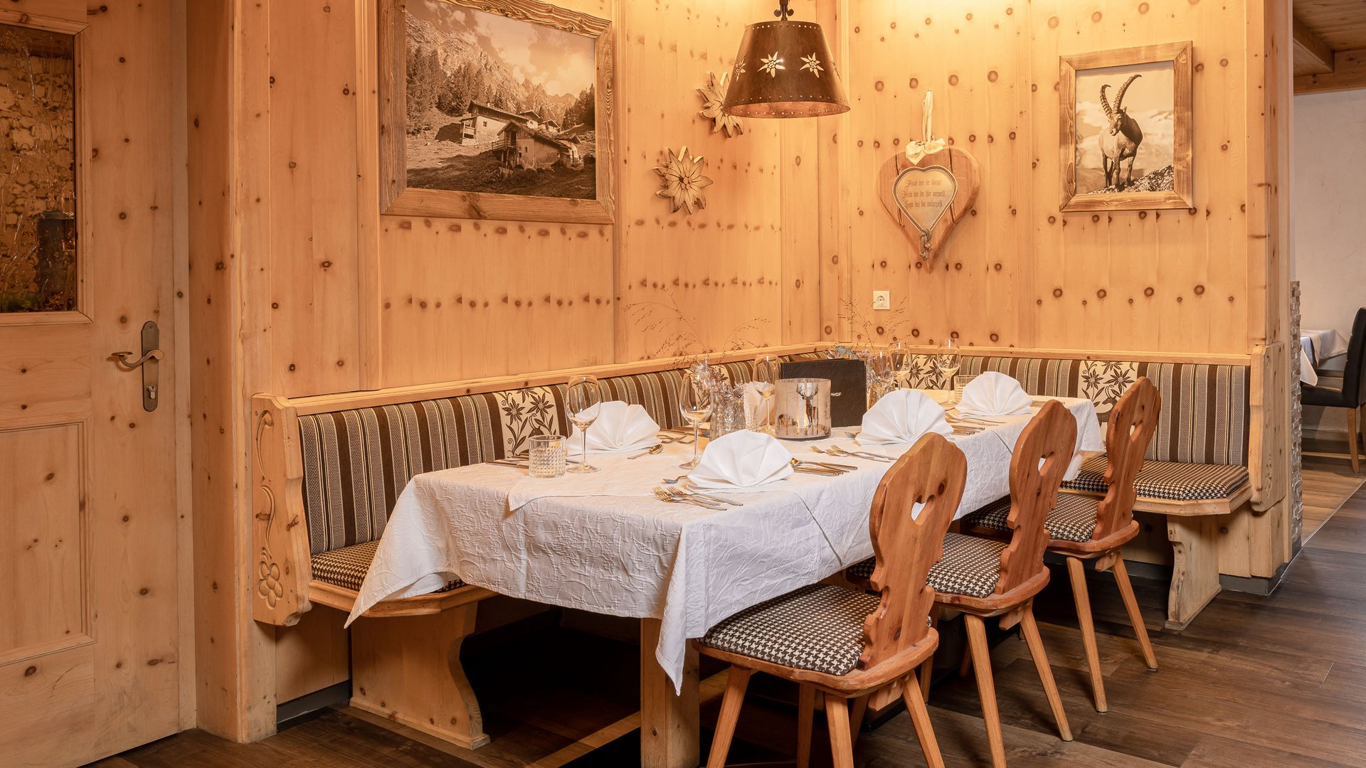 Romance in the mountains Traditional set dining table in rustic wooden corner with carpeted floor